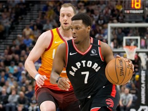 Raptors guard Kyle Lowry dribbles the ball ahead ofJazz guard Joe Ingles during the first half a regular-season game on March 9 in Salt Lake City.