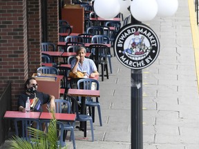 The people and the tables are spaced apart at a bakery in the ByWard Market on July 12.