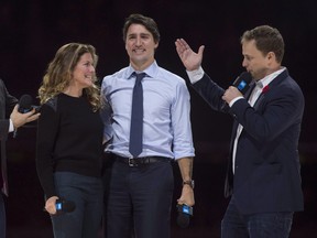 Co-founders Craig and Marc Kielburger introduce Prime Minister Justin Trudeau and his wife Sophie Gregoire-Trudeau as they appear at the WE Day celebrations in Ottawa, Tuesday November 10, 2015.