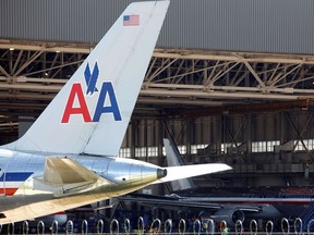 FILE PHOTO: An American Airlines airliner sits near a hanger at Dallas/Fort Worth International Airport, Texas.