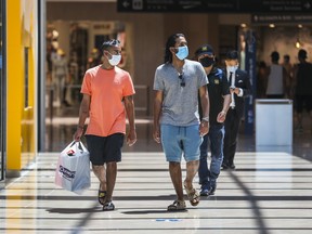 Two shoppers at CF Sherway Gardens in Toronto earlier this month.