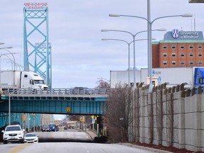 Transport trucks and other vehicles are seen near the Ambassador Bridge at the Canada/USA border crossing in Windsor, Ont. on Saturday, March 21, 2020. The mysterious, low-frequency noise that plagued the city of Windsor, Ont., for nearly a decade has finally quieted down after a steel factory across the border halted its operations indefinitely.