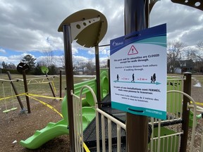 An April photo of  a closed city playground on Hutton Avenue.