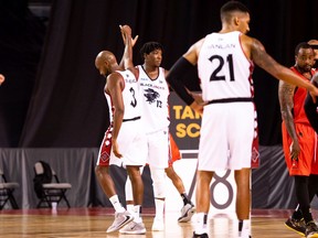 Johnny Berhanemeskel (3) high-fives Shaquille Keith (13) after the Ottawa BlackJacks defeated the Fraser Valley Bandits 78-76 during a Canadian Elite Basketball League Summer Series game at St. Catharines, Ont., on Thursday.dit: