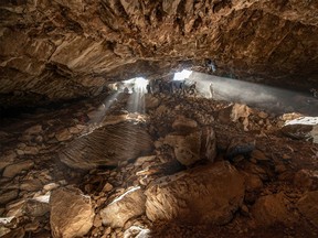 Researchers entering at a cave in Zacatecas in central Mexico, which contained stone tools and other evidence of the presence of prehistoric human populations, are seen in this image released on July 22, 2020.