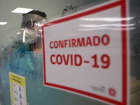 A health worker takes care a patient infected with the coronavirus disease (COVID-19) inside an Intensive Care Unit of the Posta Central hospital in Santiago, Chile.