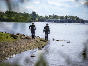 Ottawa police were on the water and combing the shore line looking for one of two men who fell into the Ottawa River between Bate Island and Remic Rapids on Friday night.