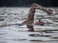 An open-water swimmer at Meech Lake a few Saturdays ago. Early-morning parking restrictions will be a problem.