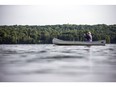 A canoeist enjoys some solitude on Meech Lake in Gatineau Park.