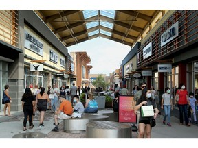 Shoppers at the Tanger Outlets in Kanata on Monday, Aug. 24, 2020.