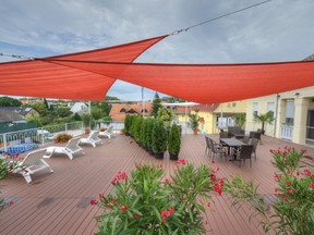 Shade sails like these offer an easy way to add protection from the sun and rain to your backyard or deck.