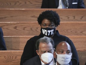 Stacy Abrams (with vote mask) attends the funeral service for the late Rep. John Lewis (D-GA) is held at Ebenezer Baptist Church on July 30, 2020 in Atlanta, Georgia. Lewis, a civil rights icon and fierce advocate of voting rights for African Americans, died on July 17 at the age of 80.