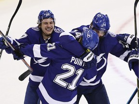 Brayden Point and the Tampa Bay Lightning celebrate his game-winning goal against the Columbus Blue Jackets at 10:27 of the fifth overtime period in Game One of the Eastern Conference First Round during the 2020 NHL Stanley Cup Playoffs at Scotiabank Arena on Aug. 11, 2020 in Toronto.