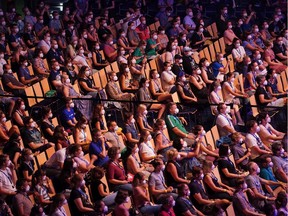 : Participants wearing FFP2 protective face masks watch singer Tim Bendzko perform in the RESTART-19 Covid transmission risk assessment study in a concert setting at an indoor arena during the coronavirus pandemic on August 22, 2020 in Leipzig, Germany. The study, organized by the University Hospital of Halle (Saale), simulates a live concert venue with several thousand audience members in three different scenarios in order to develop risk reduction measures for large events..