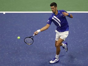 Novak Djokovic of Serbia returns a volley during his Men's Singles first round match against Damir Dzumhur of Bosnia and Herzegovina on Day One of the 2020 US Open at the USTA Billie Jean King National Tennis Center on August 31, 2020 in the Queens borough of New York City.