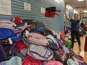 Marlene Johnson of RBC and many of volunteers filled thousands of back to school backpacks at the Westgate Shopping Centre in Ottawa, August 20, 2019.
