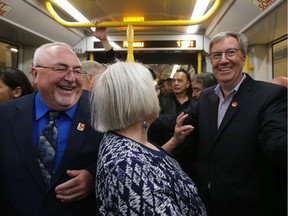 Allan Hubley (L), Marianne Wilkinson and Jim Watson enjoy the first LRT ride during the LRT launch on Sept. 14, 2019.