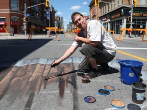 François Pelletier is a sidewalk artist painting on Bank Street.
