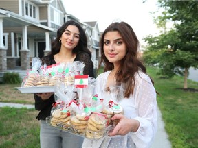 OTTAWA- August 10, 2020 --Sarah Hreich (L) and Rama El-Hakim (L).  They are baking and selling cookies and brownies to raise money for the Lebanese Red Cross, following the Beirut explosion. In just a few days, they have already raised $2,500.