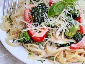 Pasta Primavera made with fresh broccoli, asparagus, red bell pepper and zucchini and served with freshly grated parmesan cheese.