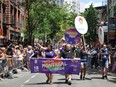 Members of Fierté Montréal march at New York's WorldPride on June 30, 2019. The Montreal pride parade, originally scheduled for Sunday, is cancelled because of the COVID-19 pandemic.