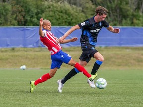 FC Edmonton striker Easton Ongaro, right, is challenge for the ball by Atlético Ottawa midfielder Javier Acuna at the Canadian Premier League Island Games tournament in Charlottetown, P.E.I., on Sunday.