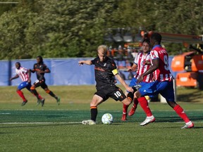 Atlético Ottawa's Mohamed Kourouma defends against Forge FC's Kyle Becker during a Canadian Premier League Island Games match at Charlottetown, P.E.I., on Sunday, Aug. 30, 2020.