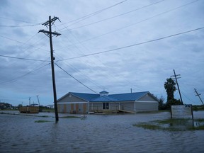 FILE: Flooding caused by Hurricane Laura on August 27, 2020 in Sabine Pass, Texas.
