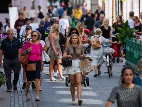 Files: People walk in Stockholm on July 27, 2020, during the novel coronavirus / COVID-19 pandemic.