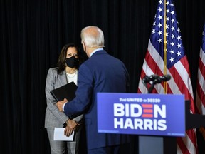 (FILES) In this file photo taken on August 13, 2020 Democratic presidential nominee, former US Vice President Joe Biden (R), and vice presidential running mate, US Senator Kamala Harris, hold a press conference after receiving a briefing on COVID-19 in Wilmington, Delaware. - This week the eyes of US voters turn to Joe Biden, Kamala Harris and the Democratic convention -- unless they swivel first to Republican distracter-in-chief Donald Trump.