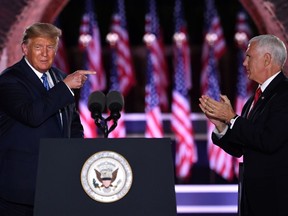 TOPSHOT - US President Donald Trump and US Vice President Mike Pence attend the third night of the Republican National Convention at Fort McHenry National Monument in Baltimore, Maryland, August 26, 2020.