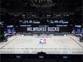 Aug 26, 2020; Lake Buena Vista, Florida, USA; The court and benches are empty of players and coaches at the scheduled start of an NBA basketball first round playoff game between the Milwaukee Bucks and the Orlando Magic, Wednesday, Aug. 26, 2020, in Lake Buena Vista, Fla. at ESPN Wide World of Sports Complex.