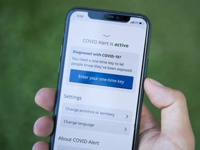 The COVID Alert app is seen on an iPhone in Ottawa, on Friday, July 31, 2020. The app tracks the locations of phones relative to other phones, and notifies users if they have been in proximity to another app user who has tested positive for COVID-19.