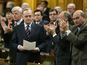 Prime Minister Jean Chretien receives a standing ovation from his caucus after announcing Canada will not participate in a war on Iraq that does not have the support of the UN Security Council, during Question Period in the House of Commons on Parliament Hill in Ottawa on March 17, 2003.
