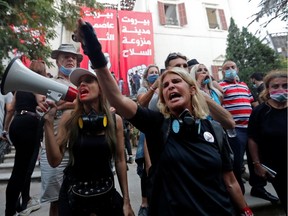 Demonstrators chant slogans outside the premises of the Lebanese foreign ministry during a protest following Tuesday's blast, in Beirut, Lebanon August 8, 2020.