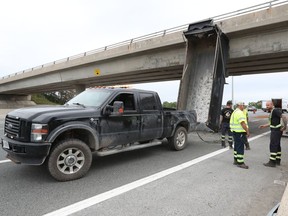 A dump truck  lost its bed as it got stuck under the 417 overpass near Canadian Tire Centre in Ontario Thursday Aug 20, 2020.