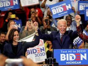 Democratic U.S. presidential candidate and former Vice President Joe Biden and U.S. Senator Kamala Harris hold hands during a campaign stop in Detroit, Michigan, U.S., March 9, 2020. She's now his running mate.