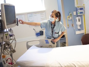 Kaitlyn Sheehan, Intensive Care Unit manager at Windsor Regional Hospital's Met campus, prepares a room ion May 13, 2020, during the COVID-19 pandemic.