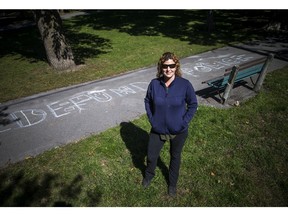 Black Lives Matter and notes about defunding the police were written in chalk in Dundonald Park, Sunday September 20, 2020.  Velvet LeClair stands in front of a defund the police chalk drawing in the park Sunday.