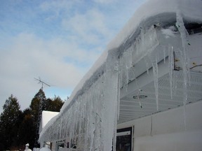 Besides being heavy, rooftop ice this thick can cause liquid water to pool in winter and leak through shingles.