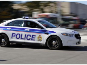 Lights and siren on, an Ottawa police cruiser vehicle races to a call.