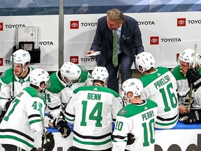 Head coach Rick Bowness of the Dallas Stars speaks to his team during a timeout against the Colorado Avalanche during the first period in Game Five of the Western Conference Second Round during the 2020 NHL Stanley Cup Playoffs at Rogers Place on August 31, 2020 in Edmonton, Alberta.
