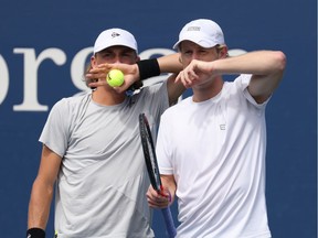 Max Purcell of Australia  and Luke Saville of Australia talk during their Men's Doubles first round match against Kevin Krawietz of Germany and Andreas Mies of Germany on Day Four of the 2020 US Open at the USTA Billie Jean King National Tennis Center on September 3, 2020 in the Queens borough of New York City.
