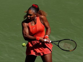 Serena Williams of the United States returns a shot during her Womens Singles third round match against Sloane Stephens of the United States on Day Six of the 2020 US Open at USTA Billie Jean King National Tennis Center in the Queens borough of New York City on Saturday.