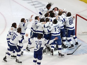Tampa Bay Lightning players celebrate after their Game 6 victory against the Dallas Stars clinched the Stanley Cup title in Edmonton on Monday night.