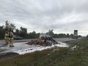 OTTAWA-Ottawa Fire Services on scene  at 417 Eastbound at Boundary Road. Firefighters have extinguished a pile of burning construction waste which caught fire inside a dump truck. The truck driver dumped the burning materials before the fire engulfed the vehicle.