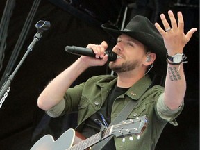 Edmonton country singer Brett Kissel plays one of eight sold-out concerts in light rain in the parking lot of River Cree Casino.