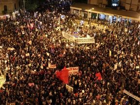 Israeli protesters gather during an anti-government demonstration in front of Prime Minister Benjamin Netanyahu's residence in Jerusalem on September 12 2020.