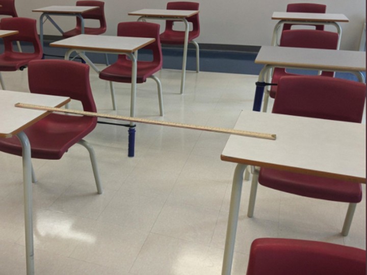  Teacher Bella Lewkowicz instructs Grades 7 and 8 students at a west-end Ottawa Catholic school. Her classroom has 24 students, with desks spaced so students are one metre apart from each other, side to side, while seated. handout