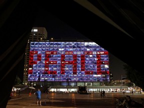 The windows of the Tel Aviv-Yafo Municipality building illuminated with the word "Peace" in English on September 15, 2020 to celebrate the signing of the landmark Israeli normalisation deals with the United Arab Emirates and Bahrain.
